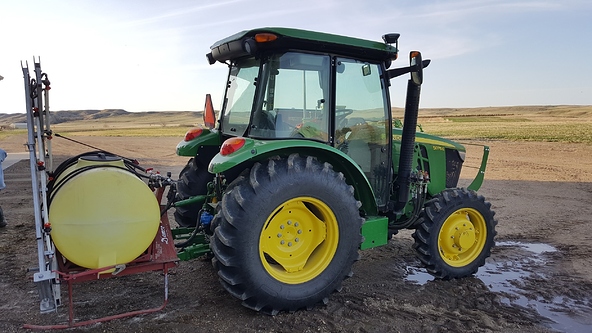 John Deere tractor with Emlid Reach RS on top